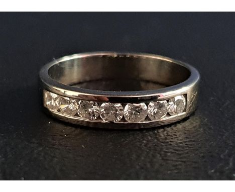 CHANNEL SET DIAMOND HALF ETERNITY RINGthe seven round cut diamonds totalling approximately 0.5cts, on Palladium shank marked 