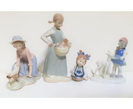 THREE NAO PORCELAIN FIGURINESdepicting a young girl holding a cat, 23cm high, girl kneeling by a dove, 15.5cm high, young gir