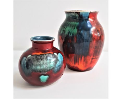 TWO POOLE POTTERY VASEScomprising one in the Gemstone pattern, 16cm high, and a Volcano urn vase, 10cm high (2) 