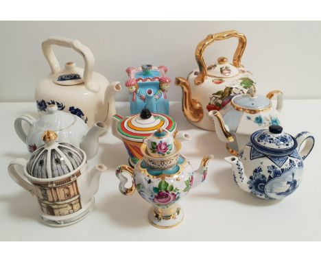 SELECTION OF NINE CERAMIC TEAPOTSincluding a Clarice Cliff inspired teapot, two barge ware teapots, a musical teapot, Past Ti