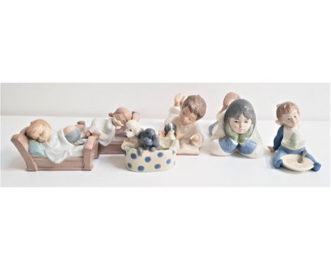 SIX NAO PORCELAIN FIGURESincluding a boy with his dog and reading a book, 18cm long, boy with a clean plate, 10cm high, an In