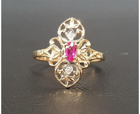 RUBY AND DIAMOND PLAQUE RINGthe central oval cut ruby in diamond set pierced surround, in nine carat gold shank, ring size O 