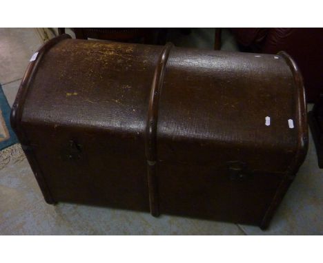 Wooden bound dome top trunk