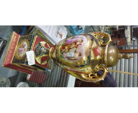 Continental ceramic urn on plinth with brass cover