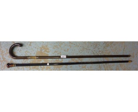 Ebonized walking cane and a walking stick
