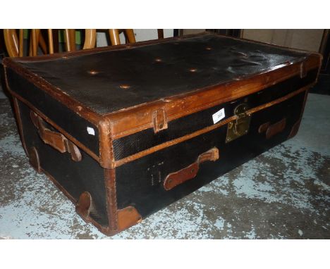 Leather bound trunk with brass padlock