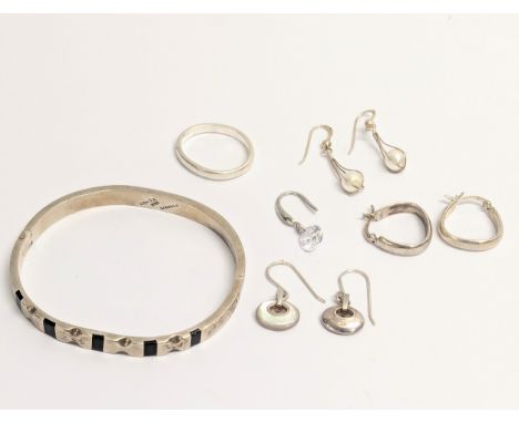A quantity of silver including bangle, earrings, ring. Total weight 42.9g 