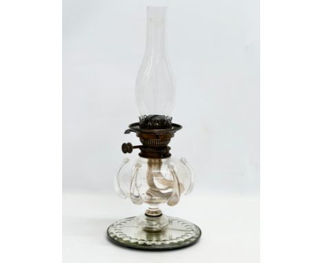 A Victorian hand blown glass bowl oil lamp on sorcerers mirror base. 20x49cm 