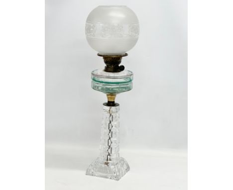 A large Victorian oil lamp with glass column, bowl and etched glass shade. 66cm 