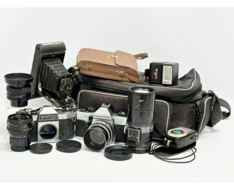 A collection of vintage cameras and lenses. A Praktica MTL 50 camera. A Praktica PL noval camera. A Pentacon 1.8/50 multi coa