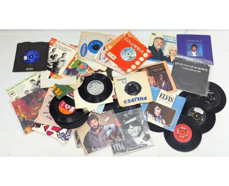 A collection of vintage vinyl 45/singles/records. 