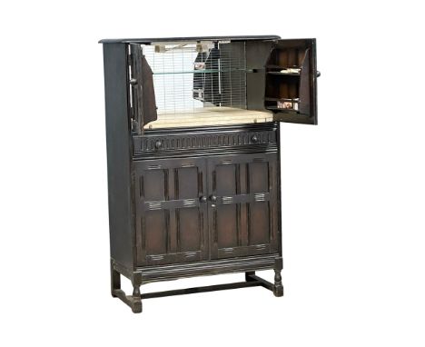 A vintage Priory style cocktail cabinet. 83x42x128 