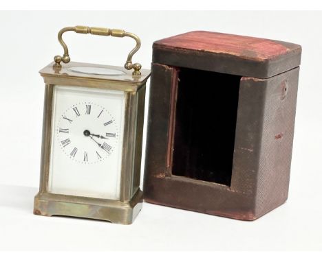 A late 19th century brass carriage clock with case. 