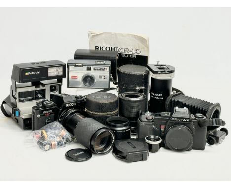 A collection of vintage cameras and lenses. Ricoh KR-10 Super camera, Pentax A3 camera, Polaroid Sun 600 camera, Kodak Instam