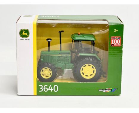 A Britains John Deere 3640 tractor in box. 20x10x14cm 