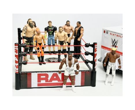 Mattel 2020 WWE collection. A Raw WWE wrestling ring with 9 figures and a WWE ambulance. Ring measures 34x34x19.5cm. Ambulanc