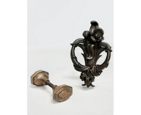 A late 19th century cast iron Art Nouveau door knocker and a Victorian brass door knob. 21cm 