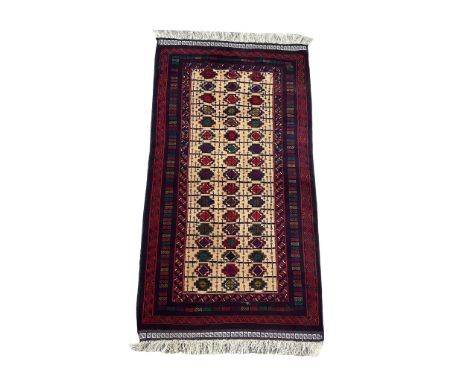 A vintage hand knotted Afghan rug. 104x210cm 