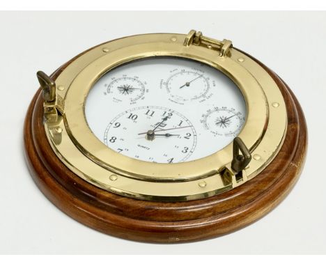 A Plastimo Porthole Weatherman barometer wall clock. 34.5cm 