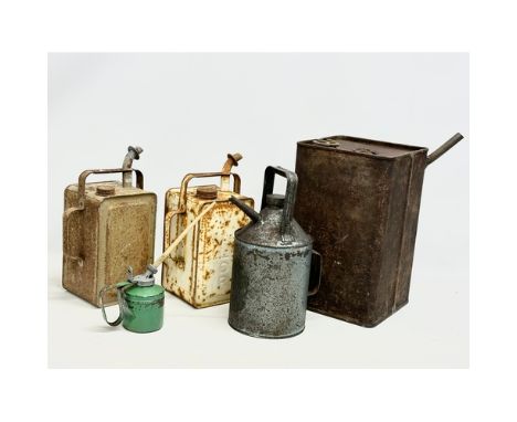 5 vintage oil cans.