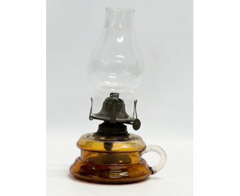 A Victorian oil lamp/finger lamp. 14x25cm 