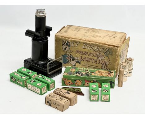A vintage Walt Disney Film Strip Lantern with accessories. Made by Johnson’s of Hendon. 