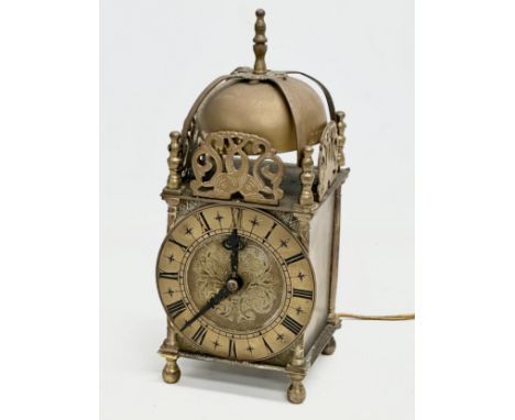 A vintage 17th century style English brass mantle clock by Smiths. 25cm 