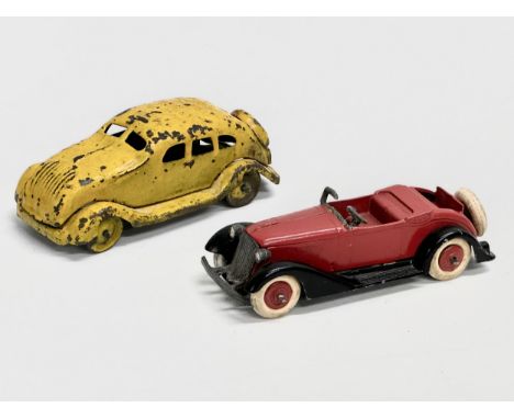A vintage Tootsie Toys Open Sportscar, 1940’s. A 1930’s yellow tinplate car. 10cm 