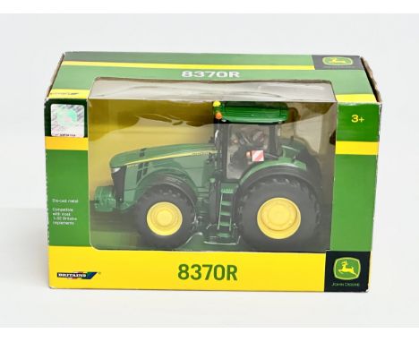 A Britains John Deere 837OR tractor in box. 25x13x16cm 