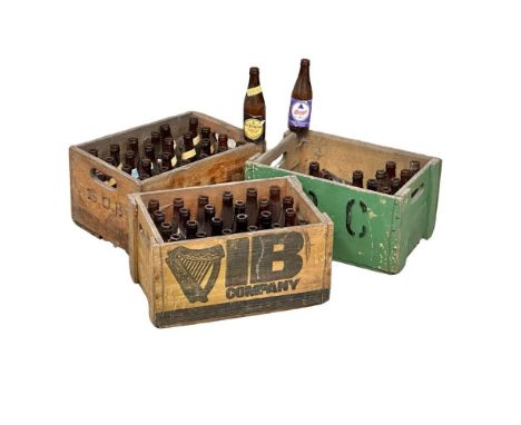 A collection of vintage beer bottles and crates. Guinness, Bass, Tennants, etc. 