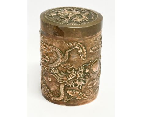 An early 20th century Chinese copper tea caddy stamped Argent. With embossed dragon and phoenix design. Circa 1900. 7x9.5cm 