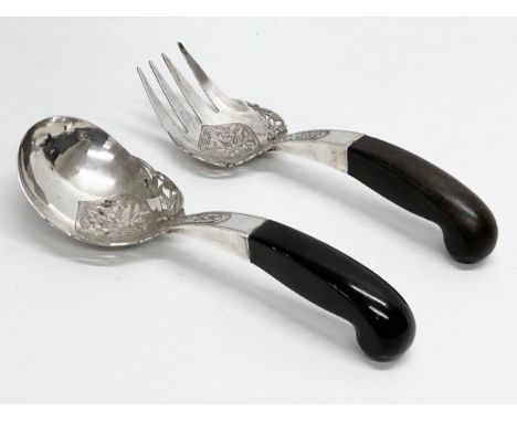 Malaysian silver. A pair of late 19th/early 20th century Malaysian silver serving tools with horn handles. 25cm 