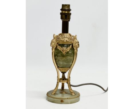 A good quality vintage French brass and onyx table lamp, decorated with rams head and draped flowers. 29cm 