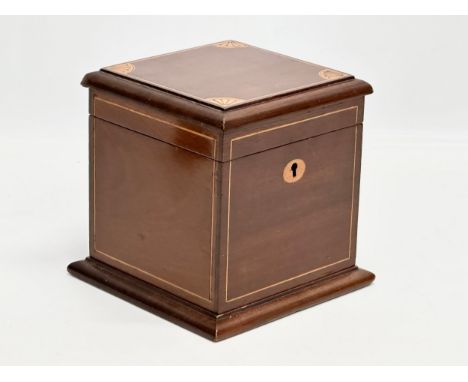 An Edwardian inlaid mahogany tea caddy. 15x15x15cm 