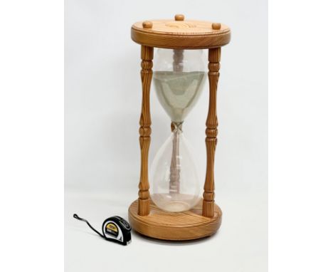 A large sand timer hourglass. 28x61cm 