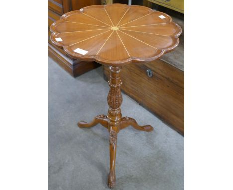 A Regency style carved walnut tripod table 