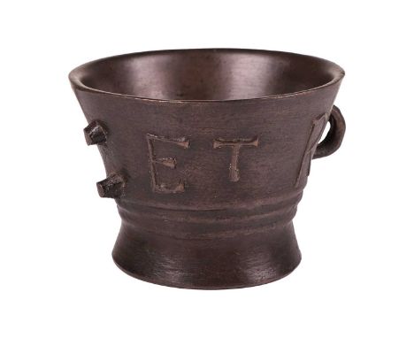 A late Elizabethan heavy bronze leaded mortar, of waisted form, 14 cm high x 19 cm diameter.Missing handle to one side. Sits 