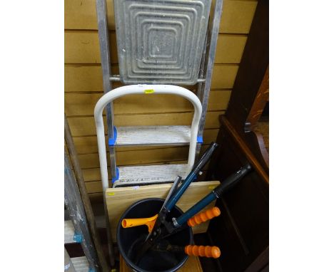 Metal stepladder and a smaller white stepladder, folding wooden table, occasional table/stool, bucket of garden tools