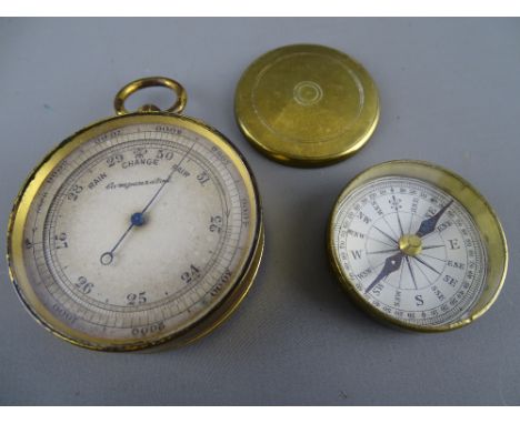 Vintage brass compensated pocket barometer and a brass cased pocket compass