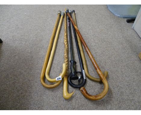 Group of vintage and other walking sticks and canes