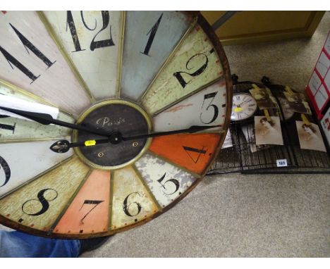 Two wirework wall clocks and a vintage style roulette wheel wall clock