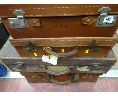 Four vintage leather and other suitcases