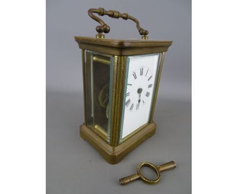Vintage brass cased carriage clock with key