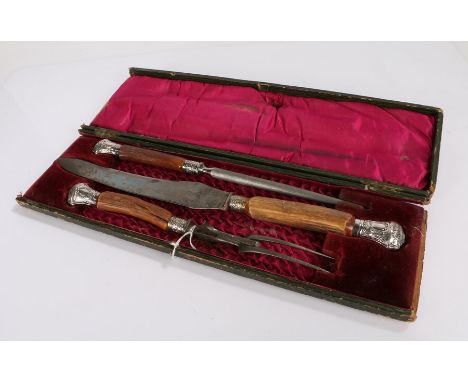 Antler handled carving set, consisting of steel, carving knife and fork, with scroll and acanthus leaf decorated mounts, the 
