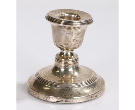 Edward VII silver candlestick, Sheffield 1908, makers mark rubbed, with reeded sconce and raised on a loaded tapering foot, 8