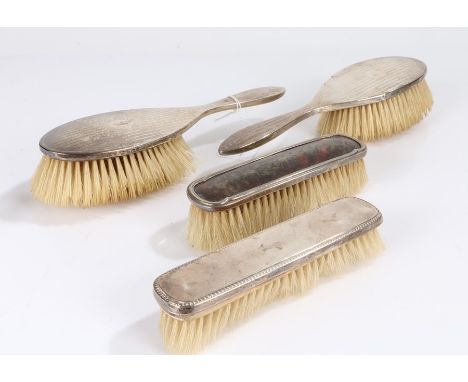 Two George V silver handled hairbrushes, Birmingham 1926, maker William Neale &amp; Son Ltd. the engine turned handles with v