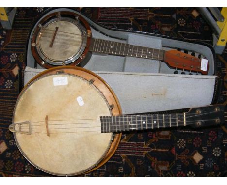 An old eight string banjo in fitted carrying case, together with one other instrument CONDITION REPORT&pound;30 postage to UK