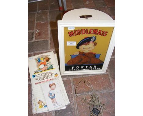 A vintage Hervey & Goodman illuminated shop advertising picture "Middlemass Scotch Shortbread", together with Mabel Lucie Att