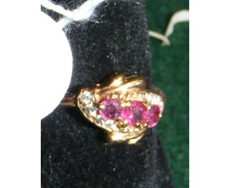 Ruby and diamond cluster ring in 18ct gold setting 