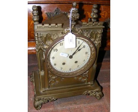 A brass Gothic style mantel clock - 39cm high 